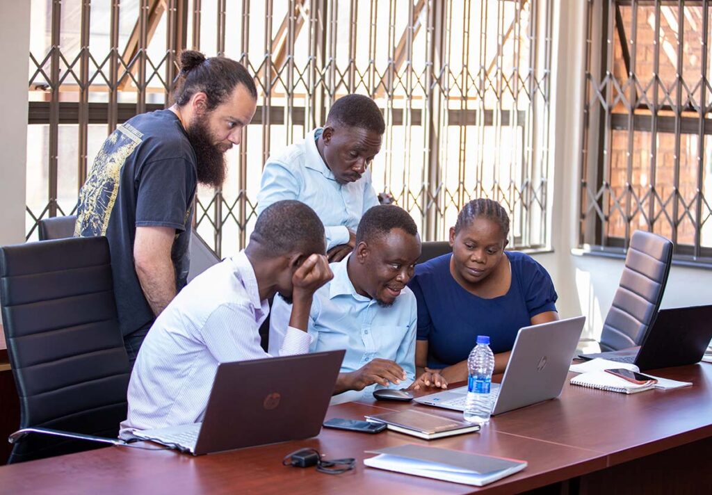 Researchers at a computer